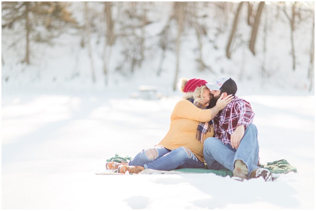 Ice Fishing Engagement Photos in LeMars, Iowa shot by Jessica Brees Photography & Videography