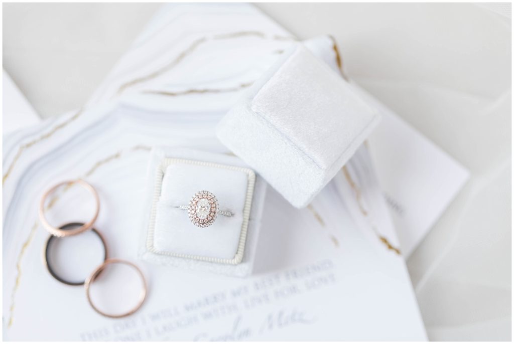 White and gold wedding invitation suite and ring set shot by Jessica Brees, Littleton Wedding Photographer and Videographer