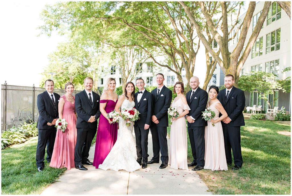 Bridal Party in Blush Dresses and Black Tuxedos | Marriott Riverfront Wedding in South Sioux City, Nebraska shot by Jessica Brees Photo & Video
